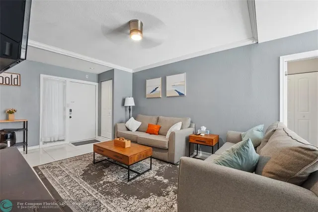 a living room with furniture and a rug