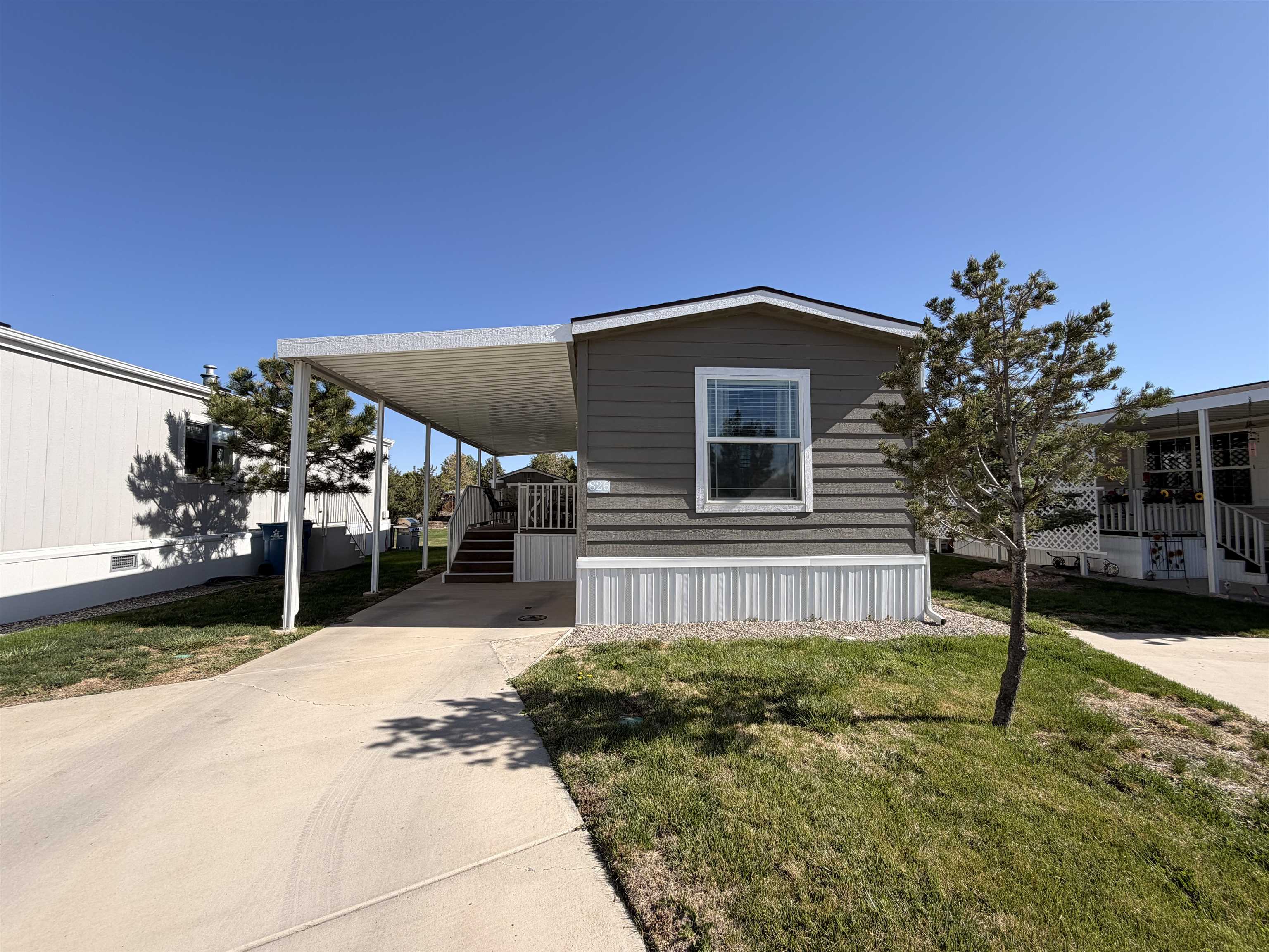435 32 Road, Unit 826 Clifton, CO 81520 - Photo 17 of 17 a front view of a house with a yard