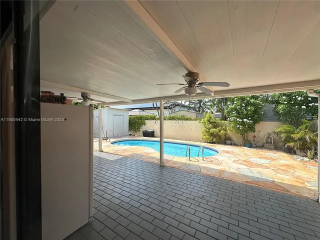 a view of a house with swimming pool
