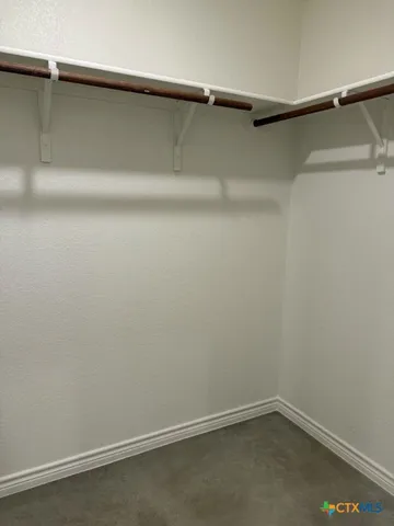 a bathroom with a double vanity sink and mirror