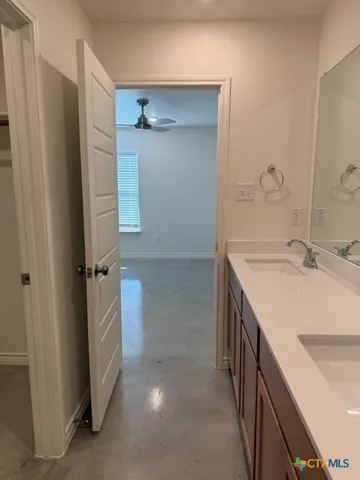 a view of a backyard with wooden fence