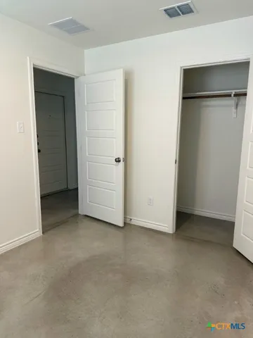 an empty room with closet