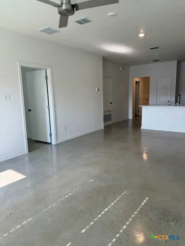 a kitchen with kitchen island cabinets and a sink