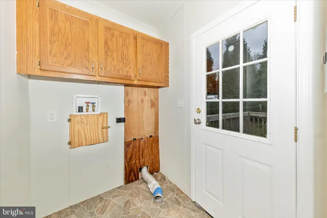 a view of a door and utility room
