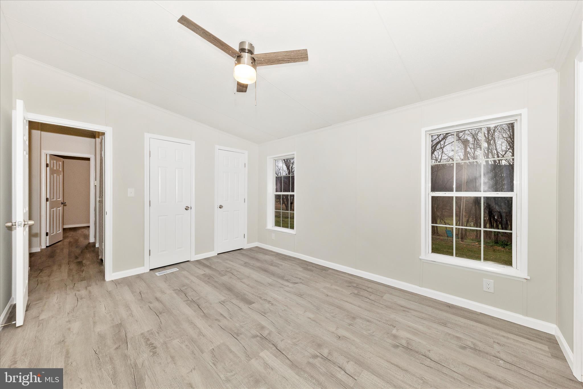 2311 Back Road Sharpsburg, MD 21782 - Photo 19 of 36 wooden floor in an empty room with a window