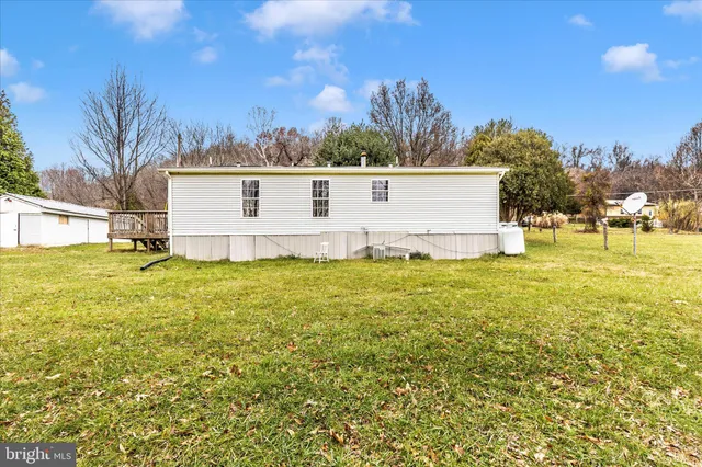 a view of a swimming pool with an outdoor space and seating area