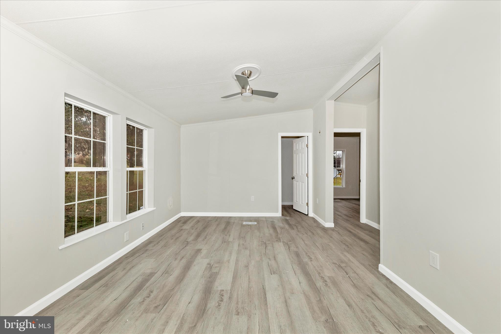 2311 Back Road Sharpsburg, MD 21782 - Photo 4 of 36 wooden floor in an empty room with a window