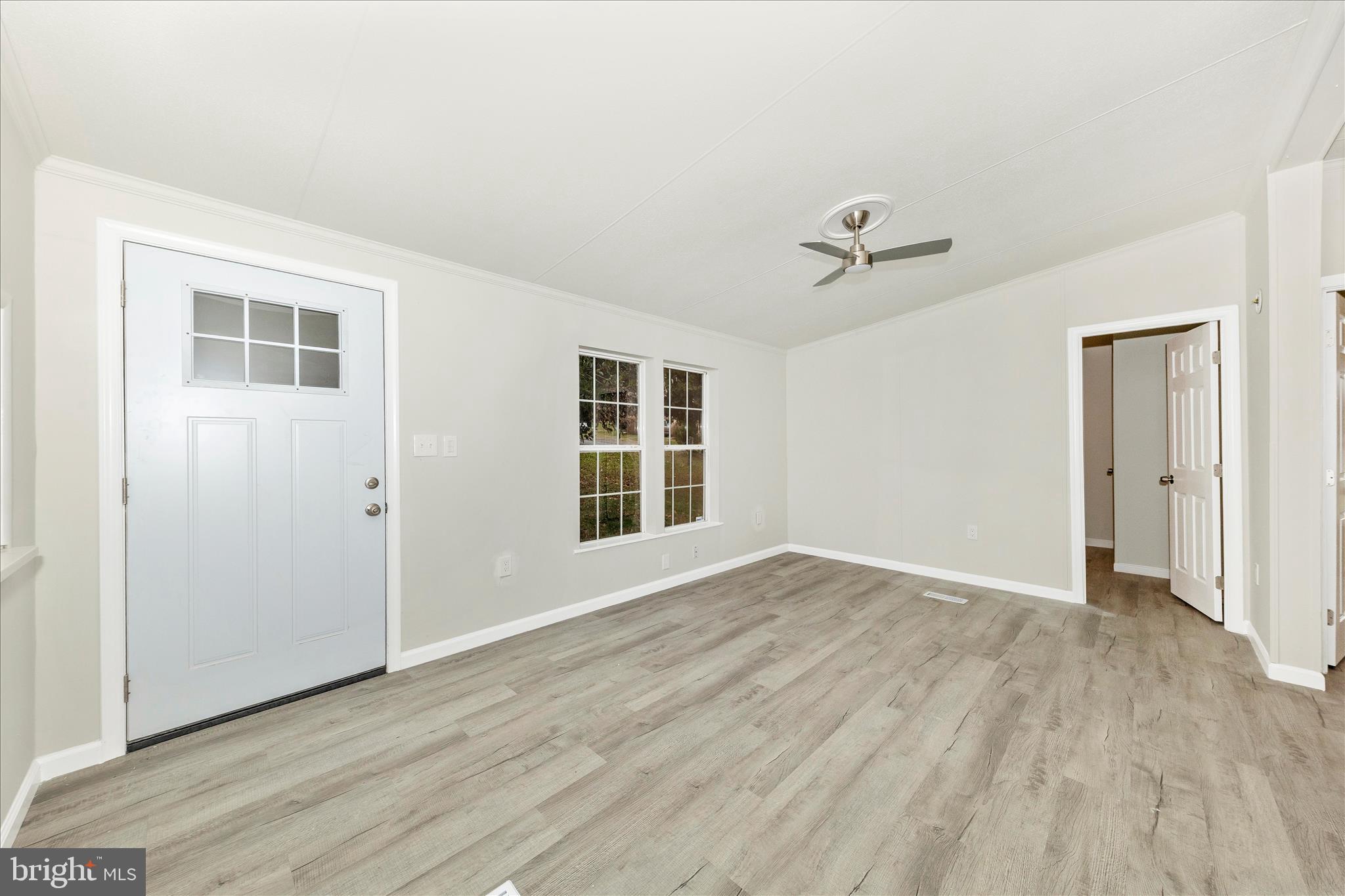 2311 Back Road Sharpsburg, MD 21782 - Photo 5 of 36 an empty room with wooden floor and windows