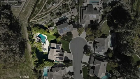 an aerial view of a house with outdoor space