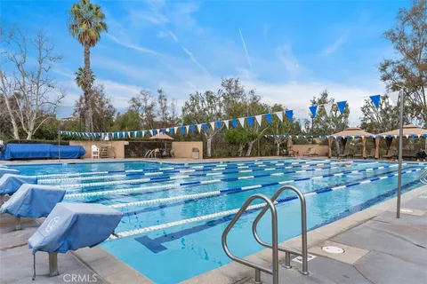 a terrace with outdoor seating and city view