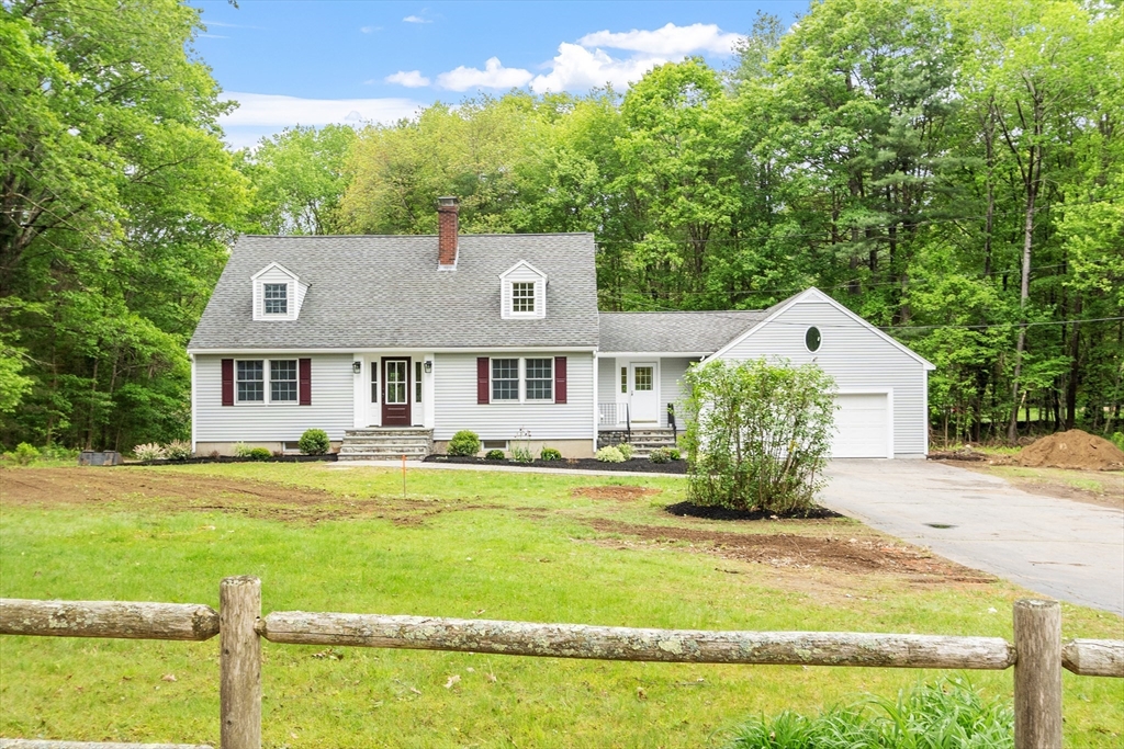 254 Taylor Road Stow, MA 01775 - Photo 1 of 42 a front view of a house with a yard