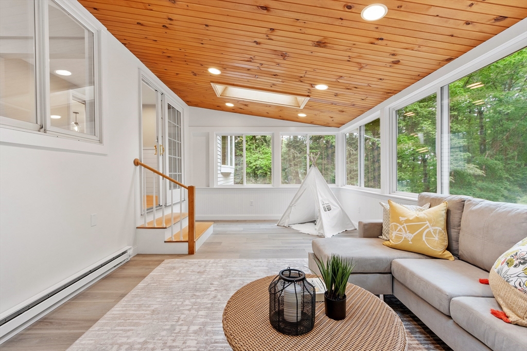 254 Taylor Road Stow, MA 01775 - Photo 12 of 42 a living room with furniture and a large window