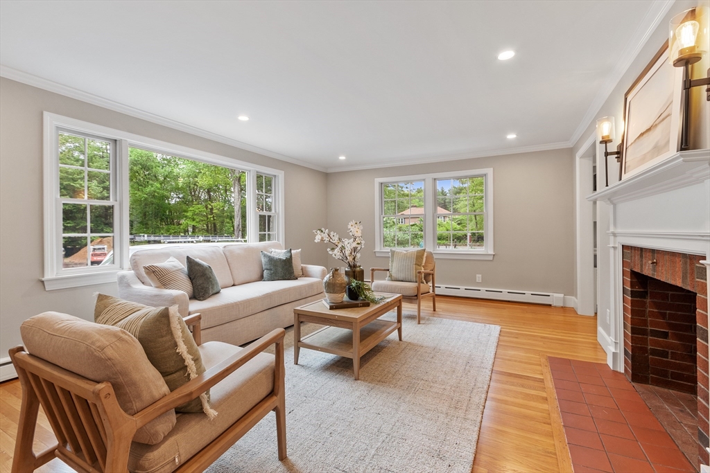 254 Taylor Road Stow, MA 01775 - Photo 15 of 42 a living room with furniture and a fireplace