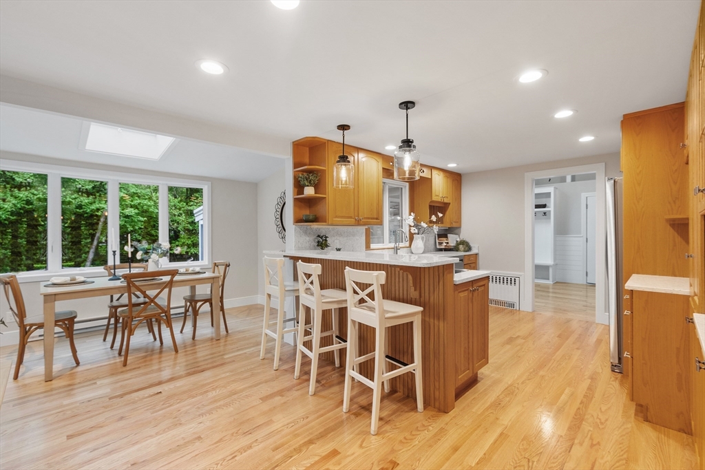 254 Taylor Road Stow, MA 01775 - Photo 16 of 42 a view of a dining room with furniture and wooden floor