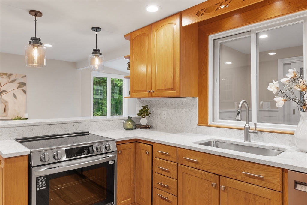 254 Taylor Road Stow, MA 01775 - Photo 17 of 42 a kitchen with a sink stove and cabinets