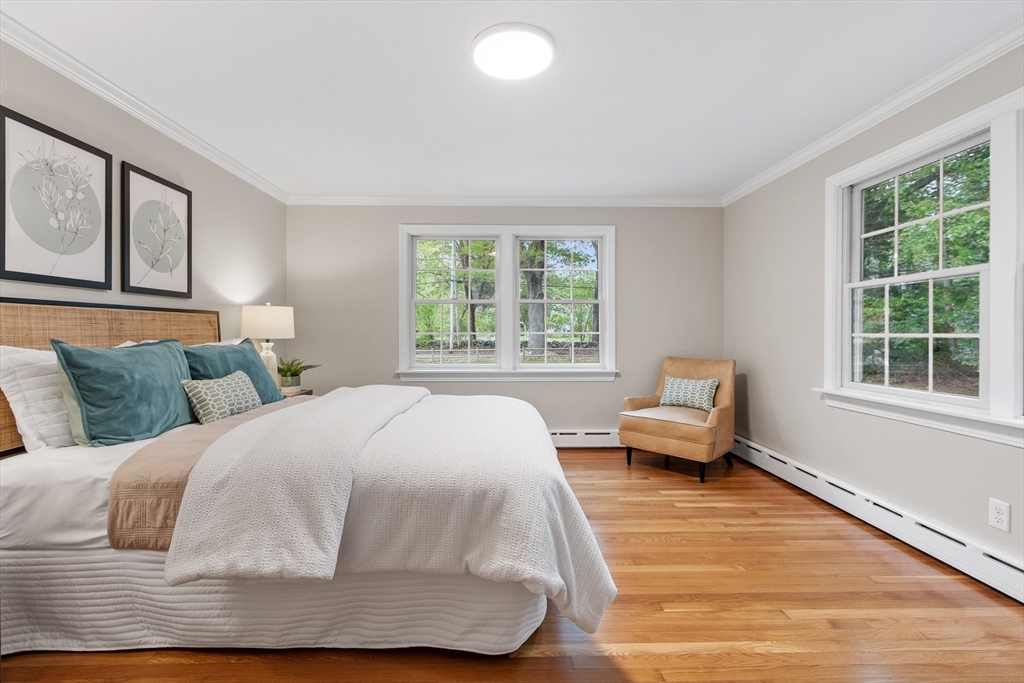 254 Taylor Road Stow, MA 01775 - Photo 25 of 42 a bedroom with a bed and wooden floor