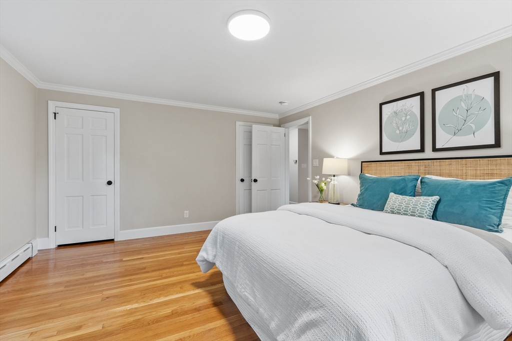 254 Taylor Road Stow, MA 01775 - Photo 26 of 42 a bedroom with a bed and a large window