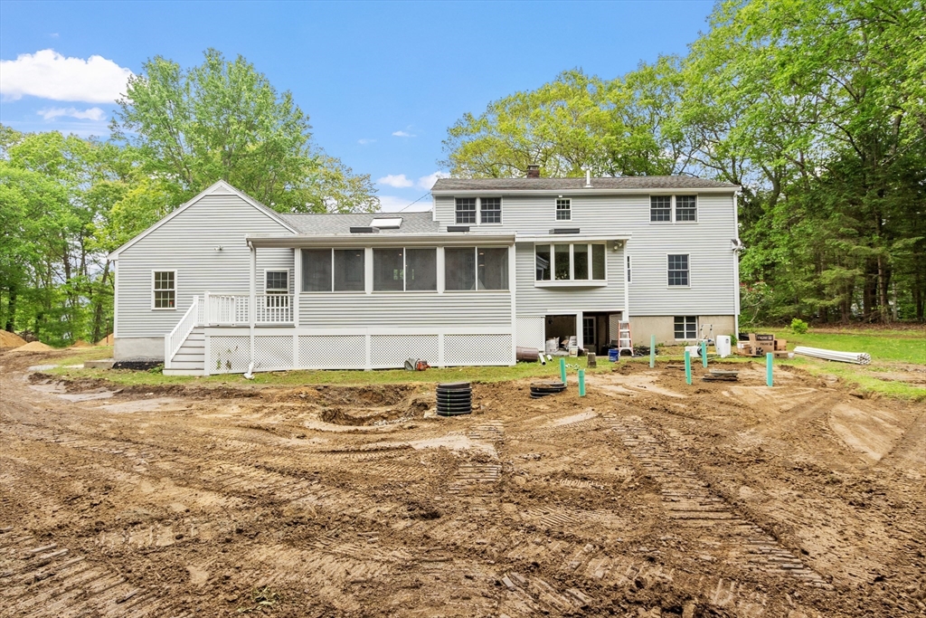 254 Taylor Road Stow, MA 01775 - Photo 3 of 42 a view of a house with swimming pool and a yard