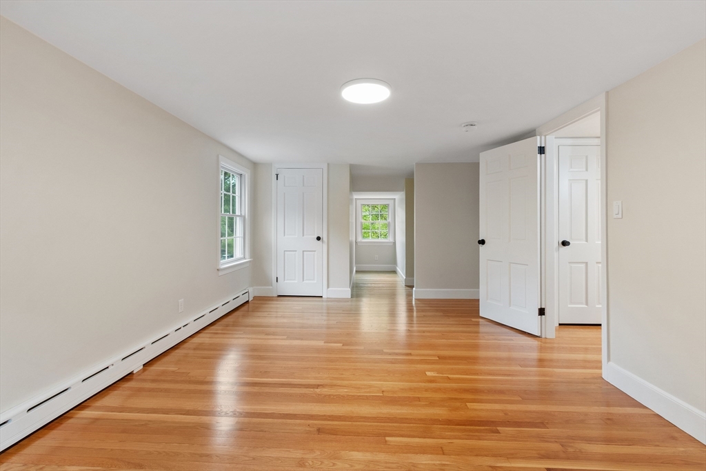 254 Taylor Road Stow, MA 01775 - Photo 31 of 42 a view of an empty room with wooden floor and closet