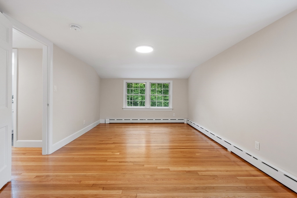 254 Taylor Road Stow, MA 01775 - Photo 35 of 42 a view of a room with wooden floor and windows