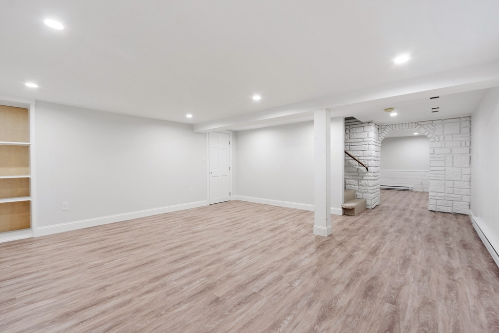 254 Taylor Road Stow, MA 01775 - Photo 38 of 42 a view of an empty room with wooden floor