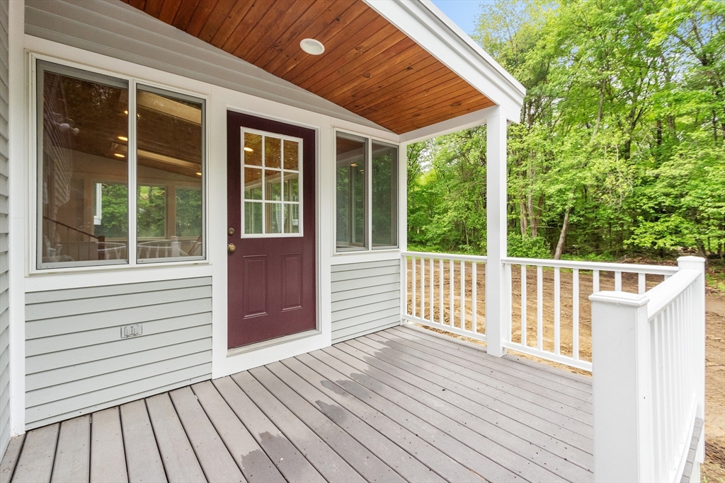 254 Taylor Road Stow, MA 01775 - Photo 10 of 42 a view of backyard with deck and wooden floor