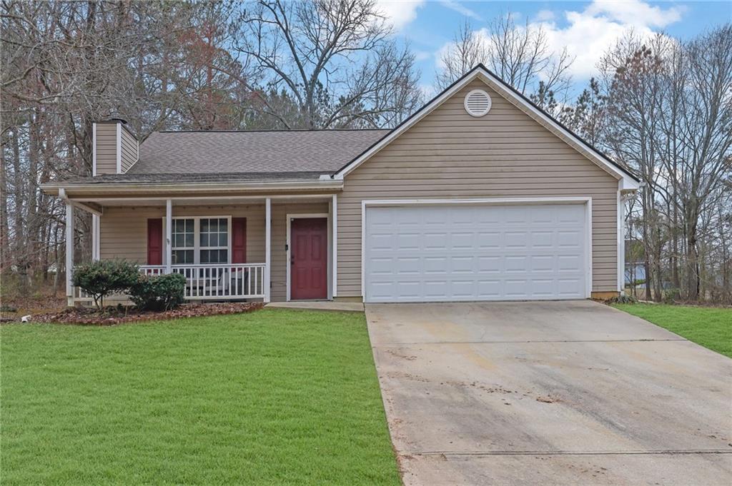 1805 Tribble Ridge Drive Lawrenceville, GA 30045 - Photo 1 of 46 a front view of house with yard and green space