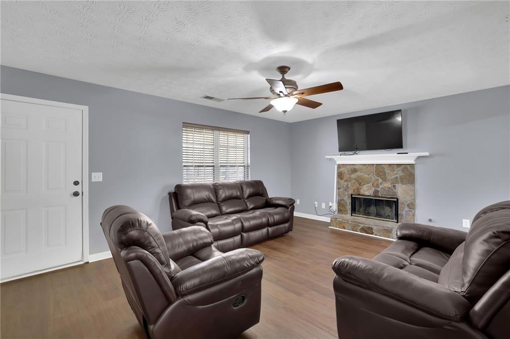 1805 Tribble Ridge Drive Lawrenceville, GA 30045 - Photo 11 of 46 a living room with furniture a fireplace