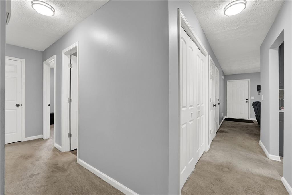 1805 Tribble Ridge Drive Lawrenceville, GA 30045 - Photo 17 of 46 a view of a hallway with white walls and door