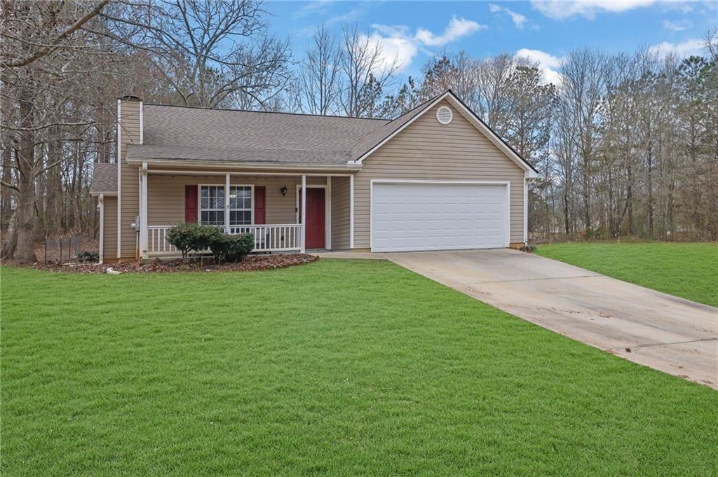 1805 Tribble Ridge Drive Lawrenceville, GA 30045 - Photo 3 of 46 a front view of a house with garden