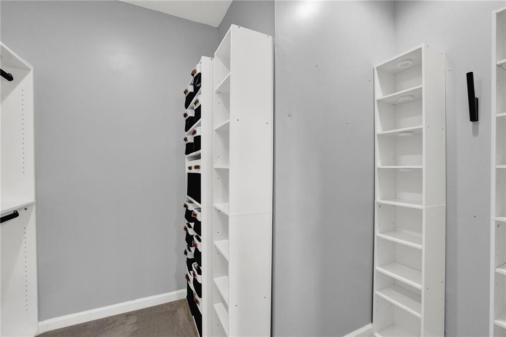 1805 Tribble Ridge Drive Lawrenceville, GA 30045 - Photo 37 of 46 a view of a hallway with cabinets and entryway