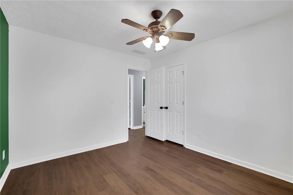 1805 Tribble Ridge Drive Lawrenceville, GA 30045 - Photo 39 of 46 a view of an empty room with wooden floor