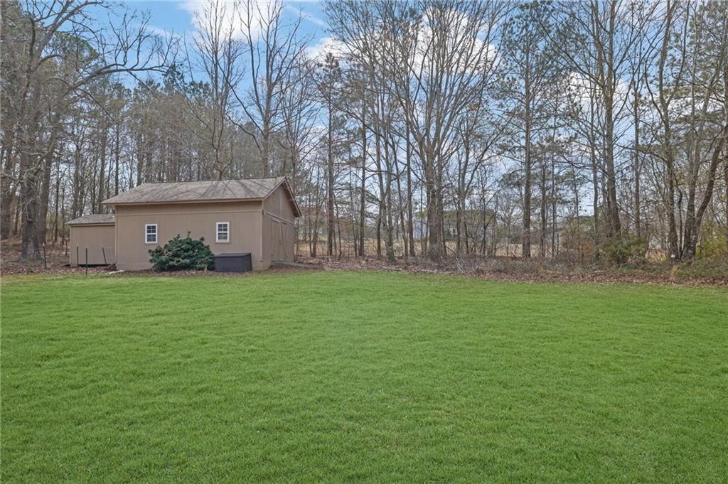 1805 Tribble Ridge Drive Lawrenceville, GA 30045 - Photo 40 of 46 a view of a house with backyard and garden