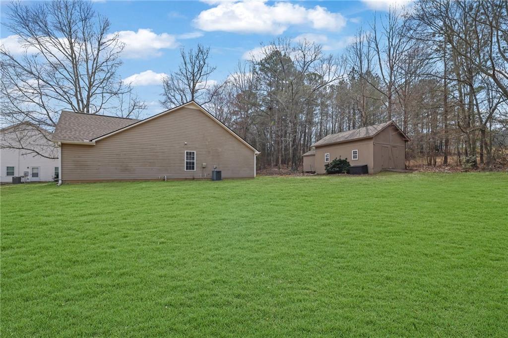 1805 Tribble Ridge Drive Lawrenceville, GA 30045 - Photo 41 of 46 a view of a house with a yard