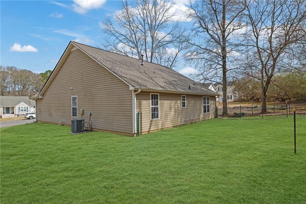 1805 Tribble Ridge Drive Lawrenceville, GA 30045 - Photo 42 of 46 a view of a house with a yard