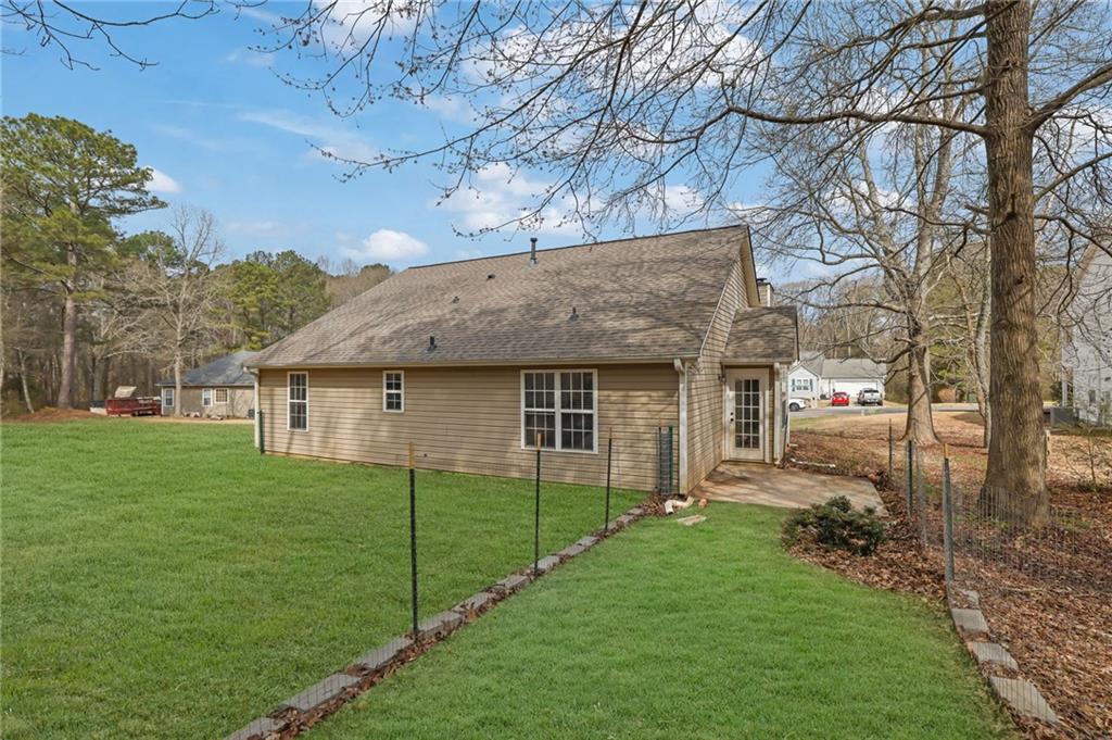 1805 Tribble Ridge Drive Lawrenceville, GA 30045 - Photo 44 of 46 a view of a house with a yard