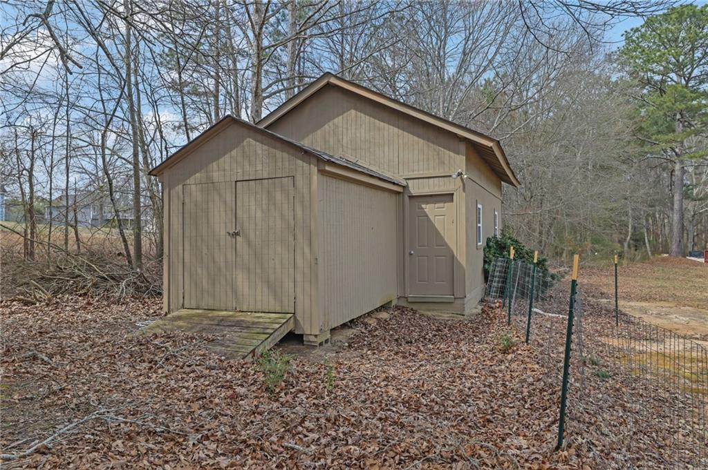 1805 Tribble Ridge Drive Lawrenceville, GA 30045 - Photo 45 of 46 a front view of a house with garden
