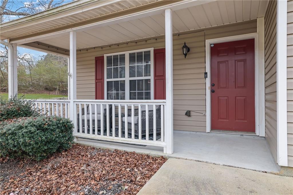 1805 Tribble Ridge Drive Lawrenceville, GA 30045 - Photo 5 of 46 a front view of a house with a porch