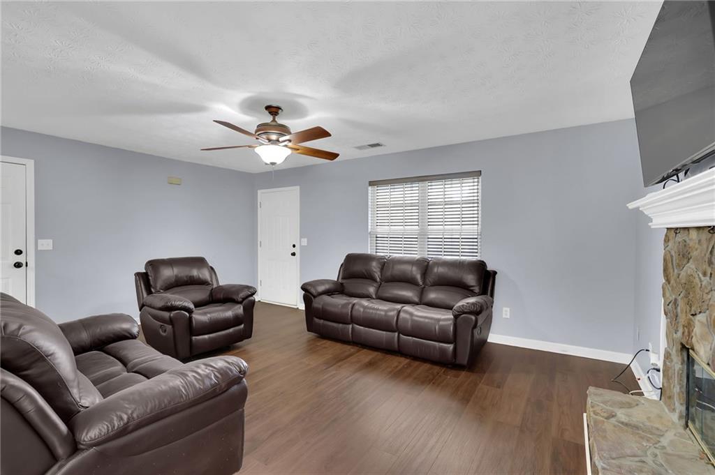 1805 Tribble Ridge Drive Lawrenceville, GA 30045 - Photo 7 of 46 a living room with furniture and a window