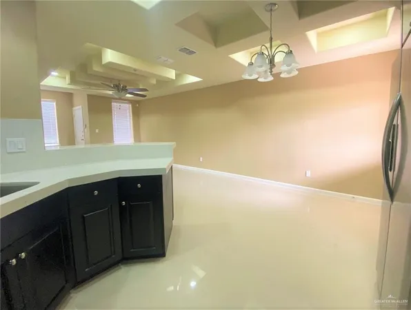 a bathroom with a sink a large mirror and a shower