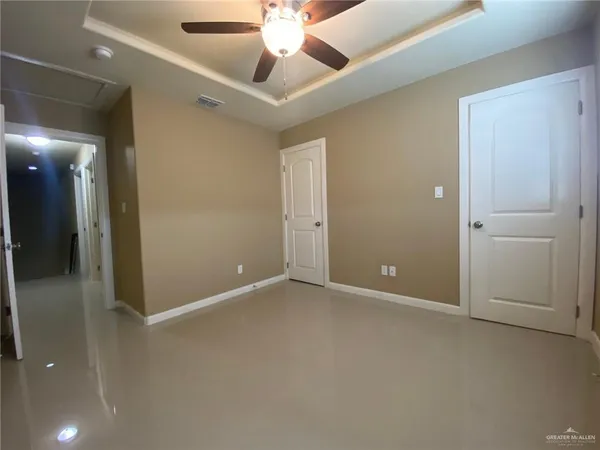 a bathroom with a granite countertop sink a toilet and a bathtub