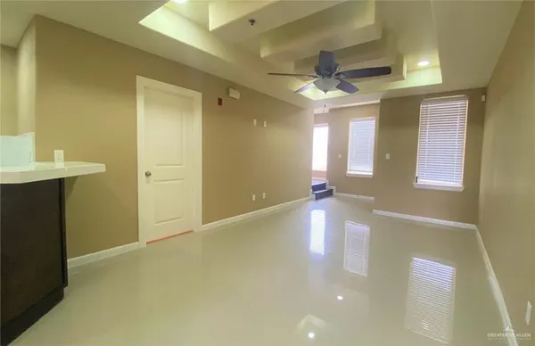 a view of a hallway with an empty room