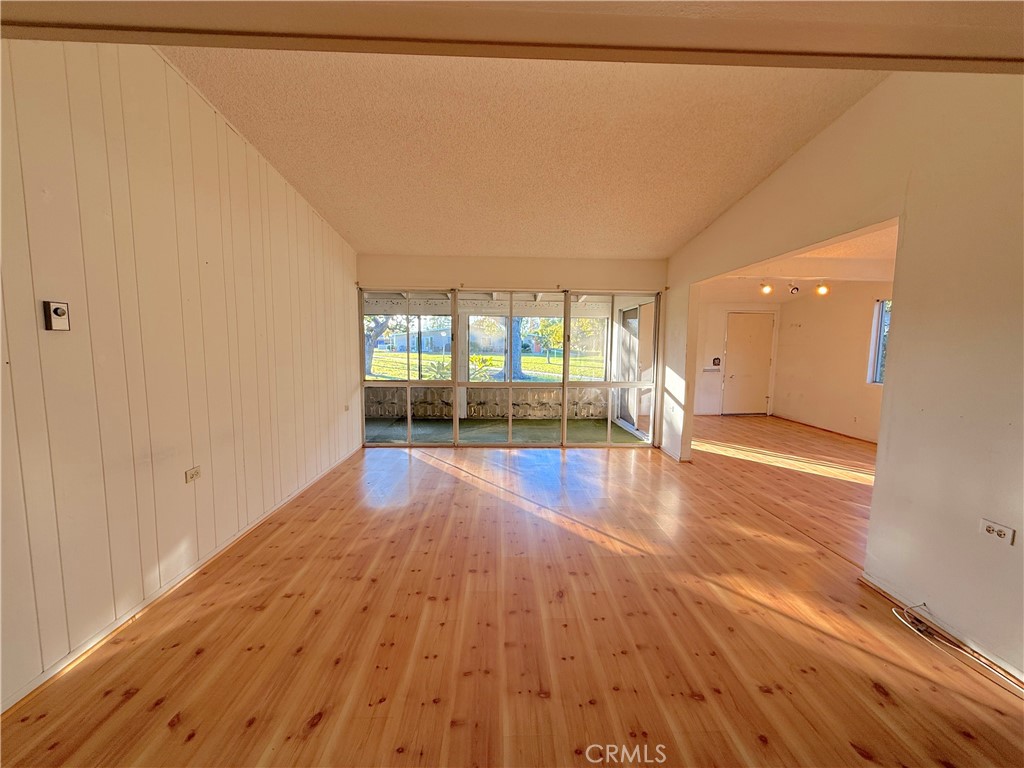 1240 Scioto Road, Unit 228F Seal Beach, CA 90740 - Photo 12 of 38 a view of empty room with wooden floor