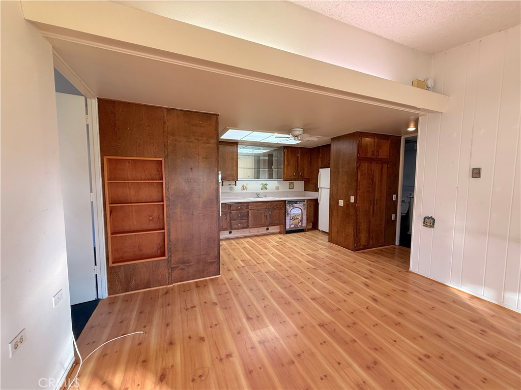 1240 Scioto Road, Unit 228F Seal Beach, CA 90740 - Photo 18 of 38 an empty room with closet and wooden floors