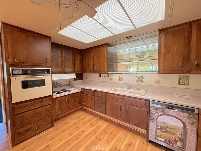 a kitchen with wooden cabinets and a sink