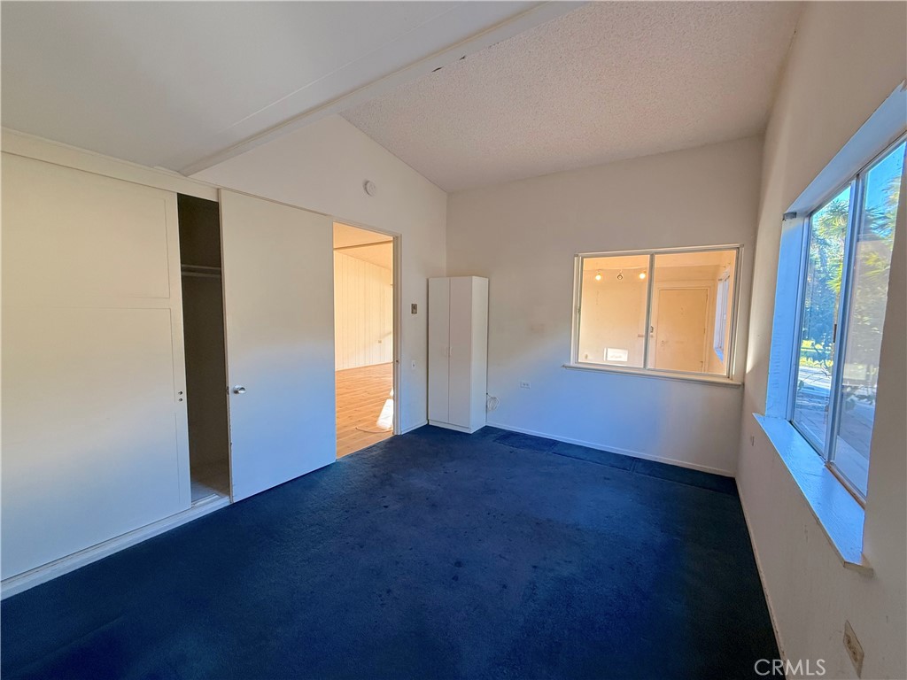 1240 Scioto Road, Unit 228F Seal Beach, CA 90740 - Photo 26 of 38 an empty room with windows