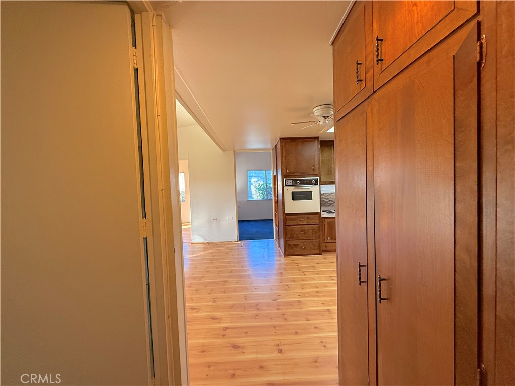 1240 Scioto Road, Unit 228F Seal Beach, CA 90740 - Photo 27 of 38 a view of a kitchen from the hallway