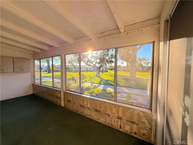 a view of an empty room with a large window