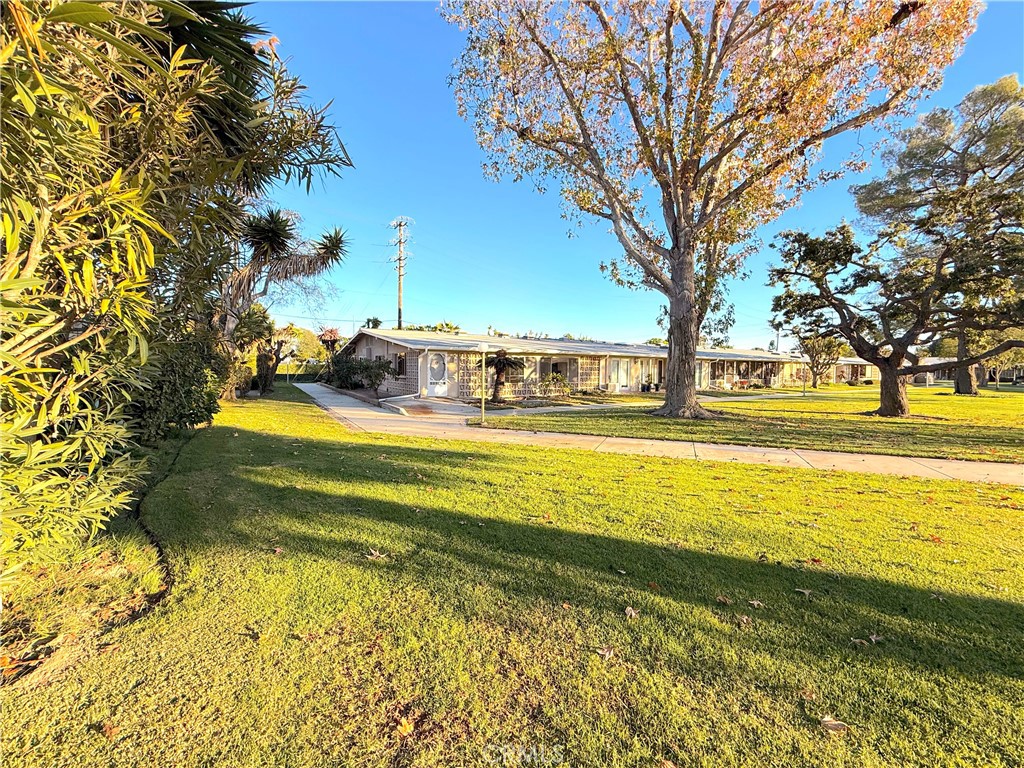 1240 Scioto Road, Unit 228F Seal Beach, CA 90740 - Photo 32 of 38 a view of a swimming pool with an outdoor space and seating area