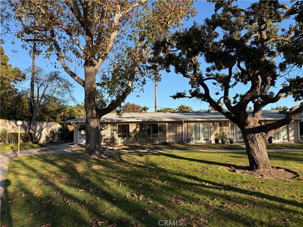 1240 Scioto Road, Unit 228F Seal Beach, CA 90740 - Photo 34 of 38 a view of a house with a yard